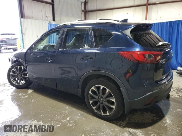 2016 Mazda CX-5 Grand Touring with VIN JM3KE4DY9G0708024, listed as a Copart auction lot 44689995 with 113,002 mi miles and Salvage Title. Bid and sale history available at DreamBid. Image 2.