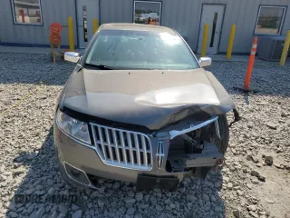 2012 Lincoln MKZ z VIN 3LNHL2JC9CR830958, wystawiony jako Copart lot #56486485 z przebiegiem 205 402 mil mil oraz Nie do naprawy. Historia ofert i sprzedaży dostępna na DreamBid. Obrazek 5.