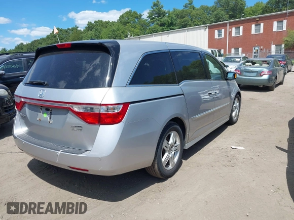 2012 Honda Odyssey Touring with VIN 5FNRL5H9XCB026741, listed as a IAAI auction lot 42808245 with 293,422 mi miles and . Bid and sale history available at DreamBid. Image 4.