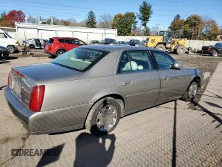 2002 Cadillac DeVille DHS z VIN 1G6KE54Y62U248629, wystawiony jako Copart lot #79825284 z przebiegiem 99 568 mil mil oraz Szkoda całkowita • Salvage title. Historia ofert i sprzedaży dostępna na DreamBid. Obrazek 3.