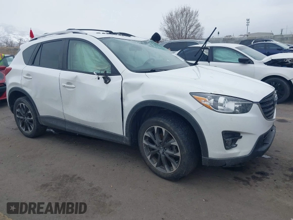 2016 Mazda CX-5 Grand Touring z VIN JM3KE2DY8G0885006, wystawiony jako IAAI lot #41615873 z przebiegiem 118 890 mil mil oraz . Historia ofert i sprzedaży dostępna na DreamBid. Obrazek 1.