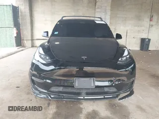 2023 Tesla Model Y Long Range with VIN 7SAYGDEE3PA185778, listed as a IAAI auction lot 39721611 with 11,986 mi miles and . Bid and sale history available at DreamBid. Image 12.