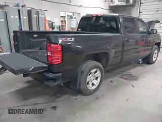 2016 Chevrolet Silverado 1500 LT with VIN 3GCUKRECXGG216804, listed as a IAAI auction lot 41825811 with 127,217 mi miles and . Bid and sale history available at DreamBid. Image 4.