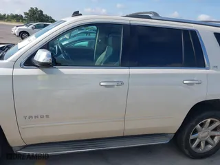 2015 Chevrolet Tahoe LTZ with VIN 1GNSCCKC4FR142856, listed as a IAAI auction lot 39886899 with 134,301 mi miles. Bid and sale history available at carsss.com. Image 14.
