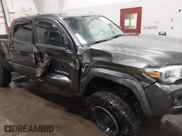 2017 Toyota Tacoma SR5 with VIN 3TMDZ5BN8HM016825, listed as a IAAI auction lot 41658400 with 166,098 mi miles. Bid and sale history available at carsss.com. Image 6.