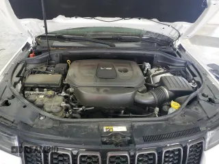 2018 Jeep Grand Cherokee Overland with VIN 1C4RJFCG5JC211145, listed as a Copart auction lot 54138865 with 115,679 mi miles and Salvage title. Bid and sale history available at DreamBid. Image 12.