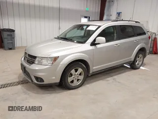 2012 Dodge Journey SXT z VIN 3C4PDDBGXCT257498, wystawiony jako IAAI lot #41746098 z przebiegiem 197 796 mil mil oraz . Historia ofert i sprzedaży dostępna na DreamBid. Obrazek 2.