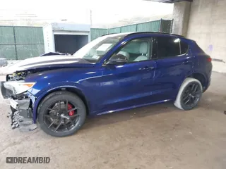 2021 Alfa Romeo Stelvio Ti with VIN ZASPAKBN4M7D21284, listed as a IAAI auction lot 40573443 with 26,230 mi miles. Bid and sale history available at carsss.com. Image 2.