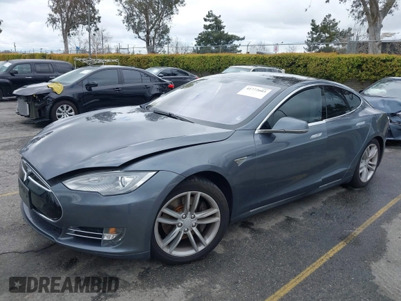 2013 Tesla Model S with VIN 5YJSA1CN8DFP21869, listed as a IAAI auction lot 41772603 with Not provided miles and . Bid and sale history available at DreamBid. Image 2.