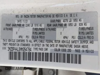 2021 Mazda 3 S z VIN 3MZBPAAL8MM254784, wystawiony jako IAAI lot #41936261 z przebiegiem 18 156 mil mil oraz . Historia ofert i sprzedaży dostępna na DreamBid. Obrazek 9.