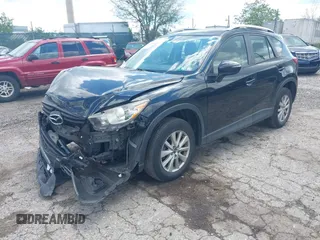 2016 Mazda CX-5 Sport with VIN JM3KE4BY2G0796577, listed as a IAAI auction lot 42230645 with 103,223 mi miles and . Bid and sale history available at DreamBid. Image 2.