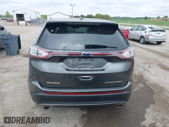 2015 Ford Edge Titanium z VIN 2FMTK3K81FBB88882, wystawiony jako IAAI lot #42184698 z przebiegiem 161 858 mil mil oraz . Historia ofert i sprzedaży dostępna na DreamBid. Obrazek 16.