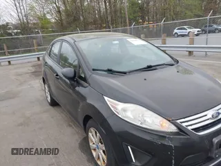 2011 Ford Fiesta SE with VIN 3FADP4BJ5BM221349, listed as a IAAI auction lot 41948737 with 216,540 mi miles. Bid and sale history available at carsss.com. Image 6.