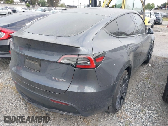 2023 Tesla Model Y Performance z VIN 7SAYGDEF6PF774965, wystawiony jako IAAI lot #41655550 z przebiegiem 33 824 mil mil oraz . Historia ofert i sprzedaży dostępna na DreamBid. Obrazek 4.