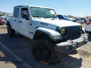 2022 Jeep Gladiator Texas Trail with VIN 1C6HJTAG8NL155888, listed as a IAAI auction lot 42433074 with 33,413 mi miles and . Bid and sale history available at DreamBid. Image 1.
