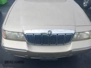 1999 Mercury Grand Marquis GS z VIN 2MEFM74W4XX645430, wystawiony jako IAAI lot #42154522 z przebiegiem 152 306 mil mil oraz . Historia ofert i sprzedaży dostępna na DreamBid. Obrazek 6.