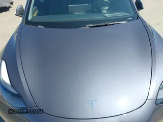 2023 Tesla Model 3 with VIN 5YJ3E1EAXPF405588, listed as a IAAI auction lot 42348952 with 30,788 mi miles and . Bid and sale history available at DreamBid. Image 10.