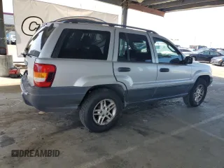 2003 Jeep Grand Cherokee Laredo with VIN 1J4GW48S23C617830, listed as a Copart auction lot 57481565 with 122,745 mi miles and Salvage title. Bid and sale history available at DreamBid. Image 3.