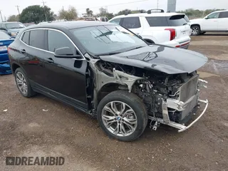 2022 BMW X2 xDrive28i with VIN WBXYJ1C01N5U20171, listed as a IAAI auction lot 41284932 with 64,256 mi miles. Bid and sale history available at carsss.com. Image 1.