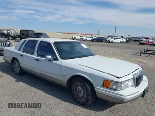 1991 Lincoln Town Car with VIN 1LNCM82W4MY780461, listed as a IAAI auction lot 42562112 with 208,151 mi miles and . Bid and sale history available at DreamBid. Image 1.