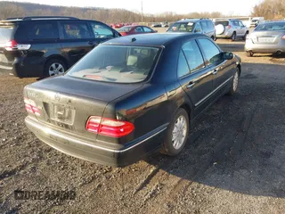 2000 Mercedes-Benz E-Class with VIN WDBJF65J1YB058351, listed as a IAAI auction lot 41834603 with 100,525 mi miles. Bid and sale history available at carsss.com. Image 4.