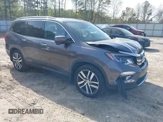2017 Honda Pilot Touring with VIN 5FNYF5H9XHB046479, listed as a IAAI auction lot 41941449 with 162,554 mi miles. Bid and sale history available at carsss.com. Image 1.