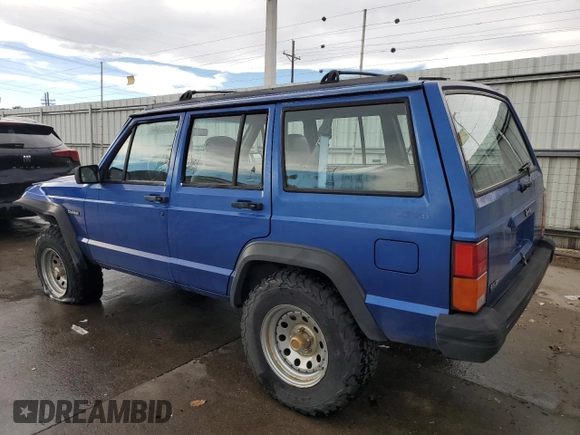 1995 Jeep Cherokee SE with VIN 1J4FJ28S9SL667332, listed as a Copart auction lot 81849264 with 201,205 mi miles and Salvage Title. Bid and sale history available at carsss.com. Image 2.