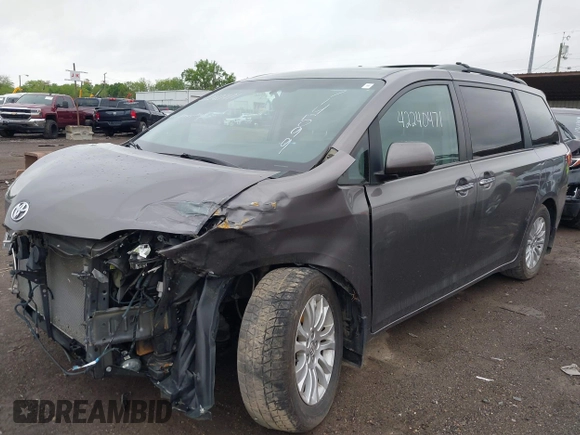 2016 Toyota Sienna XLE z VIN 5TDYK3DC3GS714599, wystawiony jako IAAI lot #42240471 z przebiegiem 135 746 mil mil oraz . Historia ofert i sprzedaży dostępna na DreamBid. Obrazek 17.