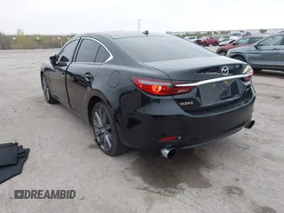 2020 Mazda 6 Grand Touring with VIN JM1GL1TY5L1513949, listed as a IAAI auction lot 40953540 with 55,616 mi miles and . Bid and sale history available at DreamBid. Image 3.