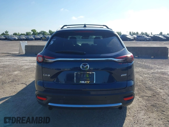 2016 Mazda CX-9 Grand Touring with VIN JM3TCADY6G0107064, listed as a IAAI auction lot 42580485 with 124,713 mi miles and . Bid and sale history available at DreamBid. Image 17.