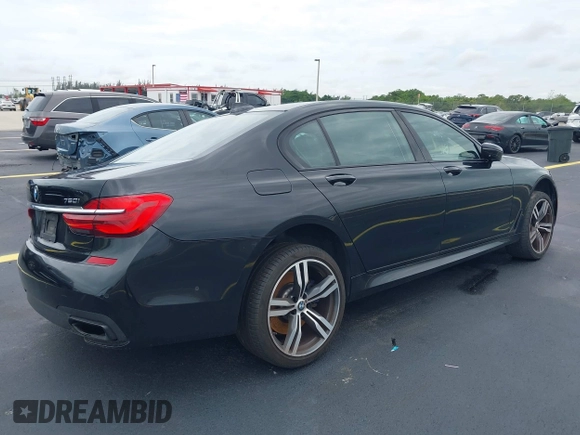 2018 BMW 7 Series 750i z VIN WBA7F0C54JGM23528, wystawiony jako IAAI lot #42205896 z przebiegiem 91 772 mil mil oraz . Historia ofert i sprzedaży dostępna na DreamBid. Obrazek 4.