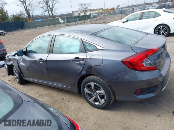 2019 Honda Civic LX with VIN 19XFC2F61KE037495, listed as a IAAI auction lot 41891007 with 90,262 mi miles and . Bid and sale history available at DreamBid. Image 14.