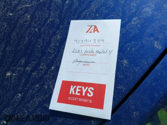 2021 Tesla Model Y Standard Range z VIN 5YJYGDED6MF107711, wystawiony jako IAAI lot #41794384 z przebiegiem 86 934 mil mil oraz . Historia ofert i sprzedaży dostępna na DreamBid. Obrazek 11.
