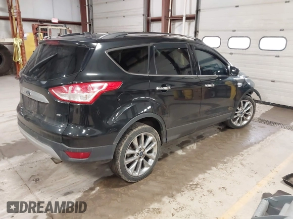 2015 Ford Escape SE with VIN 1FMCU9G9XFUA70029, listed as a IAAI auction lot 41673827 with 82,043 mi miles. Bid and sale history available at carsss.com. Image 4.