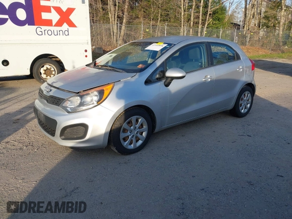 2013 Kia Rio LX with VIN KNADM5A32D6168492, listed as a IAAI auction lot 42144898 with 127,228 mi miles. Bid and sale history available at carsss.com. Image 2.