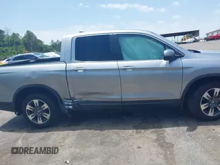 2018 Honda Ridgeline RTL z VIN 5FPYK2F5XJB001064, wystawiony jako IAAI lot #42252956 z przebiegiem 95 272 mil mil oraz . Historia ofert i sprzedaży dostępna na DreamBid. Obrazek 14.