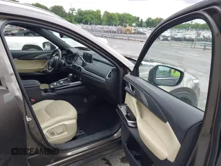 2016 Mazda CX-9 Grand Touring z VIN JM3TCADY6G0126391, wystawiony jako IAAI lot #42242541 z przebiegiem 45 147 mil mil oraz . Historia ofert i sprzedaży dostępna na DreamBid. Obrazek 5.