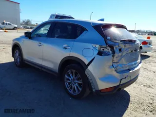 2020 Mazda CX-5 Grand Touring with VIN JM3KFADM7L0731479, listed as a IAAI auction lot 41697226 with 90,517 mi miles. Bid and sale history available at carsss.com. Image 3.