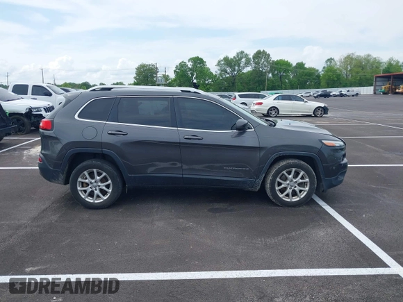 2015 Jeep Cherokee Latitude with VIN 1C4PJLCB5FW689811, listed as a IAAI auction lot 42113567 with 113,740 mi miles and . Bid and sale history available at carsss.com. Image 13.