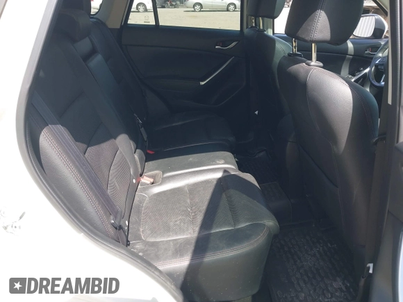 2016 Mazda CX-5 Grand Touring with VIN JM3KE4DY0G0632693, listed as a IAAI auction lot 42123142 with 106,592 mi miles. Bid and sale history available at carsss.com. Image 8.