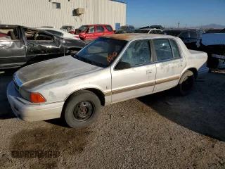 1991 Dodge Spirit z VIN 1B3XA5639MF549470, wystawiony jako Copart lot #76051284 z przebiegiem 62 309 mil mil oraz Szkody całkowita. Historia ofert i sprzedaży dostępna na DreamBid. Obrazek 1.