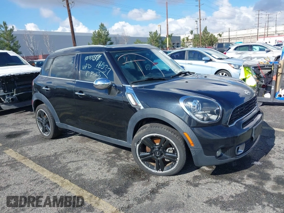 2014 MINI Countryman S with VIN WMWZC3C56EWP27880, listed as a IAAI auction lot 38577048 with 96,812 mi miles and . Bid and sale history available at DreamBid. Image 1.
