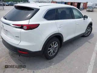 2019 Mazda CX-9 Touring with VIN JM3TCACY1K0334804, listed as a IAAI auction lot 42411662 with 49,447 mi miles and . Bid and sale history available at DreamBid. Image 4.
