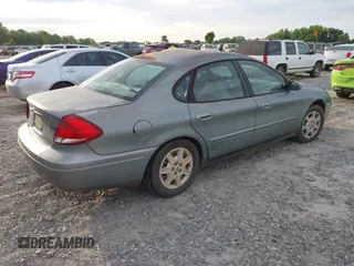 2007 Ford Taurus SE z VIN 1FAFP53U67A148052, wystawiony jako IAAI lot #42189672 z przebiegiem 297 373 mil mil oraz . Historia ofert i sprzedaży dostępna na DreamBid. Obrazek 4.
