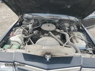 1992 Cadillac Brougham z VIN 1G6DW54E9NR713312, wystawiony jako Copart lot #71659794 z przebiegiem 41 467 mil mil oraz Tytuł czysty. Historia ofert i sprzedaży dostępna na DreamBid. Obrazek 11.