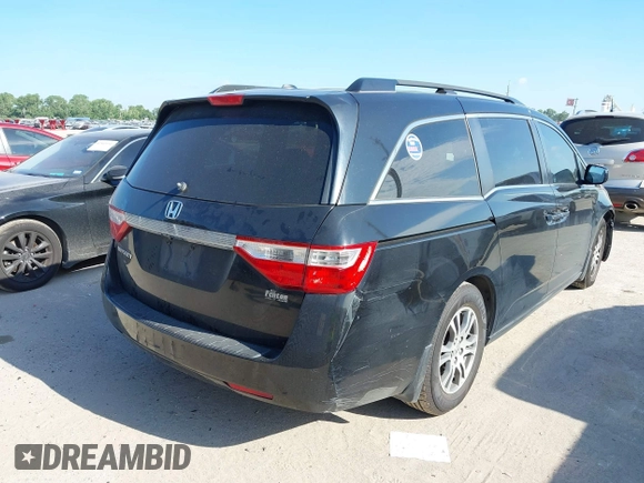 2012 Honda Odyssey EX-L z VIN 5FNRL5H63CB046447, wystawiony jako IAAI lot #42578775 z przebiegiem 247 852 mil mil oraz . Historia ofert i sprzedaży dostępna na DreamBid. Obrazek 4.