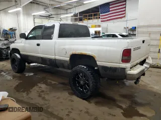 2000 Dodge 1500 z VIN 3B7HF12Z7YG161262, wystawiony jako Copart lot #43696945 z przebiegiem 143 767 mil mil oraz Szkoda całkowita • Salvage title. Historia ofert i sprzedaży dostępna na DreamBid. Obrazek 2.