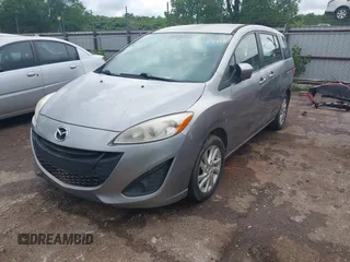 2012 Mazda 5 Sport with VIN JM1CW2BL0C0111151, listed as a IAAI auction lot 42359887 with 158,986 mi miles and . Bid and sale history available at DreamBid. Image 2.