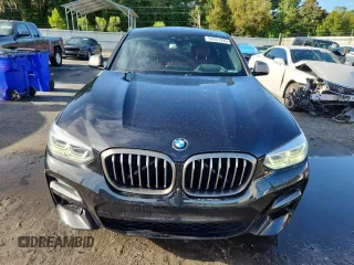2021 BMW X4 M40i with VIN 5UX2V5C05M9F68427, listed as a Copart auction lot 64941095 with 50,208 mi miles and Salvage title. Bid and sale history available at DreamBid. Image 5.