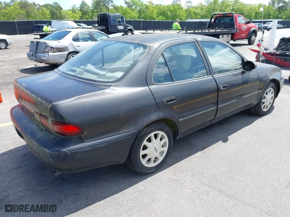 1996 Geo Prizm LSi with VIN 1Y1SK526XTZ026795, listed as a IAAI auction lot 42008701 with 178,017 mi miles. Bid and sale history available at carsss.com. Image 4.